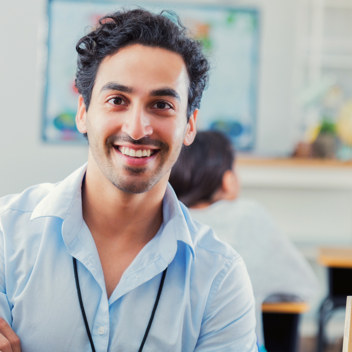 Confident young male high school teacher